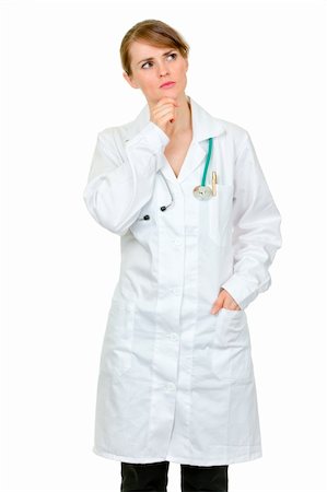 simsearch:400-04351236,k - Thoughtful medical doctor woman looking  up at copy space isolated on white Photographie de stock - Aubaine LD & Abonnement, Code: 400-04842471