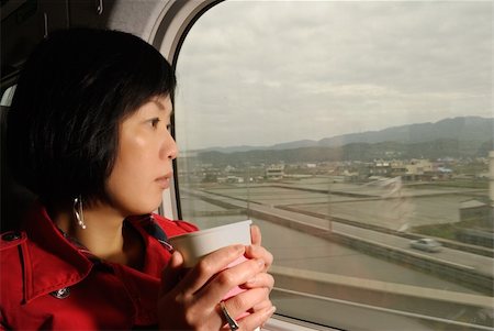 Traveler woman of Asian in train looking outside of window, half length closeup portrait indoor. Photographie de stock - Aubaine LD & Abonnement, Code: 400-04842791