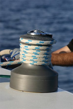 sailboat pulley - modern winch and rope with a man's arm behind Stock Photo - Budget Royalty-Free & Subscription, Code: 400-04843263