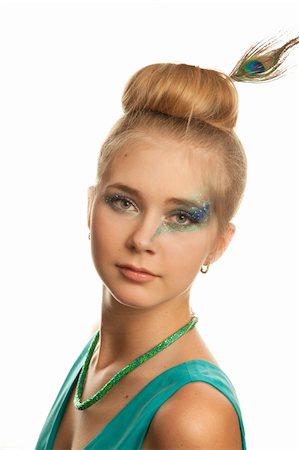 Portrait of the young woman with with a peacock feather. Isolated on white background Stock Photo - Budget Royalty-Free & Subscription, Code: 400-04843562