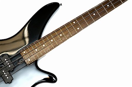 Fragment of black  Bass Electric Guitar With Four Strings, isolated Foto de stock - Royalty-Free Super Valor e Assinatura, Número: 400-04843882