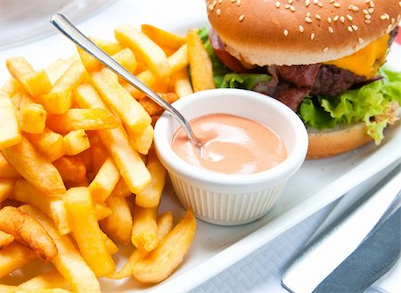 simsearch:400-05330097,k - Cheese burger - American cheese burger with fresh salad Stock Photo - Budget Royalty-Free & Subscription, Code: 400-04854159