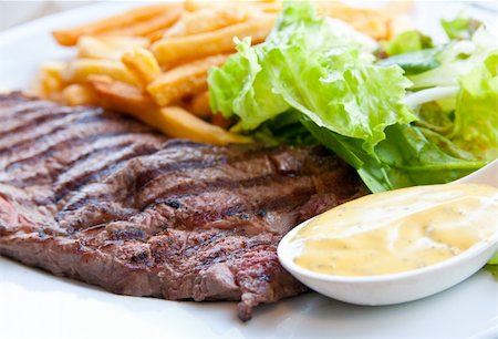 simsearch:400-05664697,k - juicy steak beef meat with salad and french fries Stock Photo - Budget Royalty-Free & Subscription, Code: 400-04854165