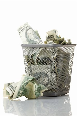 Money in basket. Isolated over white. Stock Photo - Budget Royalty-Free & Subscription, Code: 400-04854348