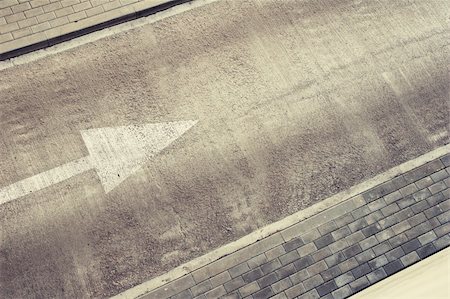 simsearch:400-06138811,k - Empty road area with direction arrow and pavement. Can be used as background for text. Photographie de stock - Aubaine LD & Abonnement, Code: 400-04854428