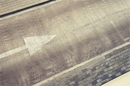 simsearch:400-06138811,k - Empty road area with direction arrow and pavement. Can be used as background for text. Stock Photo - Budget Royalty-Free & Subscription, Code: 400-04854428