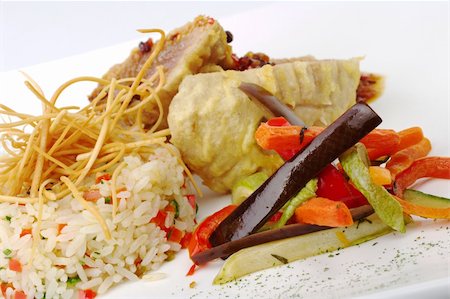 peruvian food gourmet - Main dish: Fried vegetables with rice and fish in the background (Selective Focus) Stock Photo - Budget Royalty-Free & Subscription, Code: 400-04855007