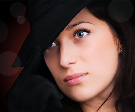 simsearch:400-05164576,k - Portrait of a beautiful brunette young woman with black hat and gloves Foto de stock - Royalty-Free Super Valor e Assinatura, Número: 400-04855397