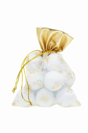 simsearch:400-07046956,k - Golf balls in gift sachet on white background Stock Photo - Budget Royalty-Free & Subscription, Code: 400-04855603