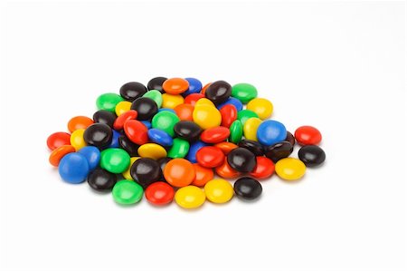 simsearch:400-04855702,k - Colorful assortment of Chocolate button candies on white background Photographie de stock - Aubaine LD & Abonnement, Code: 400-04855667