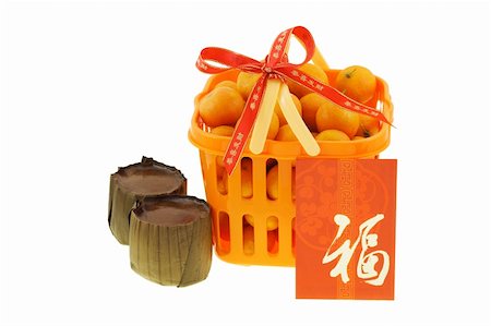 Gift basket of mandarin oranges and Chinese new year rice cakes  on white background Stock Photo - Budget Royalty-Free & Subscription, Code: 400-04855672