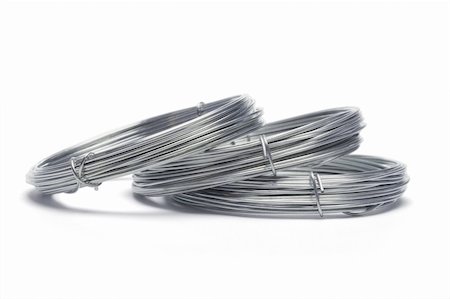simsearch:400-04865353,k - Coils of galvanized wires lying on white background Foto de stock - Royalty-Free Super Valor e Assinatura, Número: 400-04855880