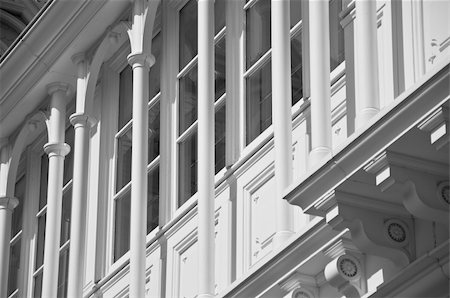 A photograph of the exterior of a building showing windows with arches and columns. Stock Photo - Budget Royalty-Free & Subscription, Code: 400-04855965