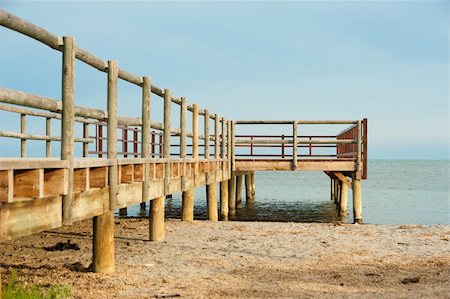 simsearch:400-08223992,k - Wooden footbrige on an idyllic calm beach Stock Photo - Budget Royalty-Free & Subscription, Code: 400-04856265