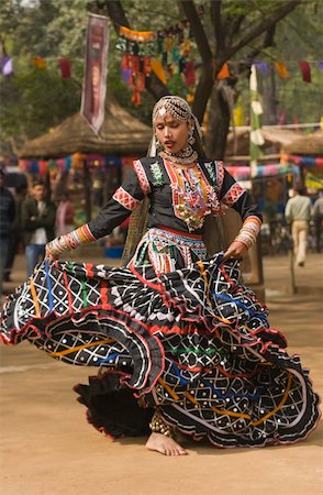 dancers of rajasthan - Female kalbelia dancer in traditional tribal dress performing at the annual Sarujkund Fair near Delhi, India Stock Photo - Budget Royalty-Free & Subscription, Code: 400-04856364