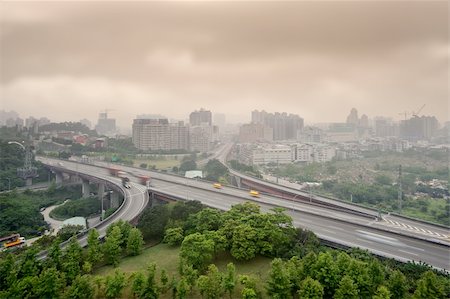 schienenkreuzung - Sunset cityscape of highway and buildings with bad weather and air pollution, city scenery in Taipei, Taiwan. Stockbilder - Microstock & Abonnement, Bildnummer: 400-04856562