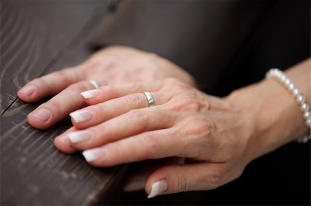 Detail shot of the hands of a bridal couple with the wedding bands Stock Photo - Budget Royalty-Free & Subscription, Code: 400-04856866