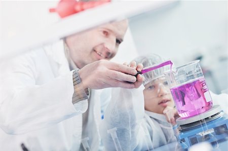 scientist and teacher photo - science and chemistry classes with teacher and young school boy at bright lab Stock Photo - Budget Royalty-Free & Subscription, Code: 400-04856956