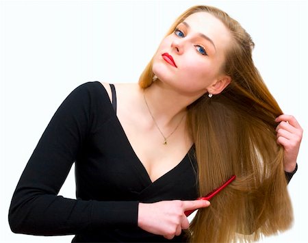 The young girl combs hair a crest Stockbilder - Microstock & Abonnement, Bildnummer: 400-04857223