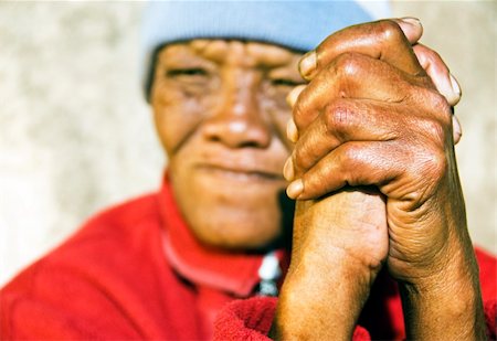 photographic portraits poor people - Old African woman with folded hands - focus on the weathered hands Stock Photo - Budget Royalty-Free & Subscription, Code: 400-04857514