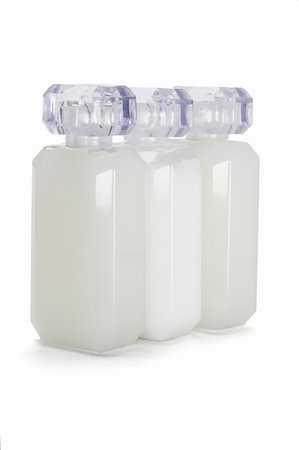 simsearch:6108-05857134,k - Three glass bottles of toiletries on white background Stock Photo - Budget Royalty-Free & Subscription, Code: 400-04857811