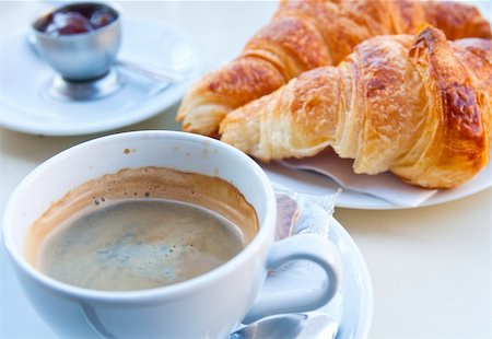 eating bread and butter - Breakfast with coffee and croissants in a basket on table Stock Photo - Budget Royalty-Free & Subscription, Code: 400-04857933