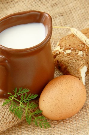 simsearch:400-04499805,k - Glass jug with milk and  eggs on natural background of rustic style Photographie de stock - Aubaine LD & Abonnement, Code: 400-04858171