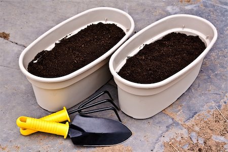 two planters ready for planting flowers and garden tools Stock Photo - Budget Royalty-Free & Subscription, Code: 400-04858930