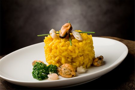 seafood risotto - photo of delicious risotto with saffron and seafood on wooden table Stock Photo - Budget Royalty-Free & Subscription, Code: 400-04859376