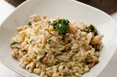 seafood risotto - photo of delicious risotto with seafood and parsley on it Stock Photo - Budget Royalty-Free & Subscription, Code: 400-04859384