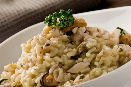 seafood risotto - photo of delicious risotto with seafood and parsley on it Stock Photo - Budget Royalty-Free & Subscription, Code: 400-04859386