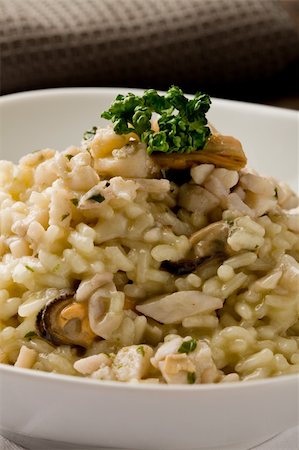 seafood risotto - photo of delicious risotto with seafood and parsley on it Stock Photo - Budget Royalty-Free & Subscription, Code: 400-04859387