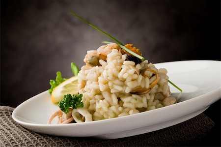 seafood risotto - photo of delicious risotto with seafood and parsley on it Stock Photo - Budget Royalty-Free & Subscription, Code: 400-04859380