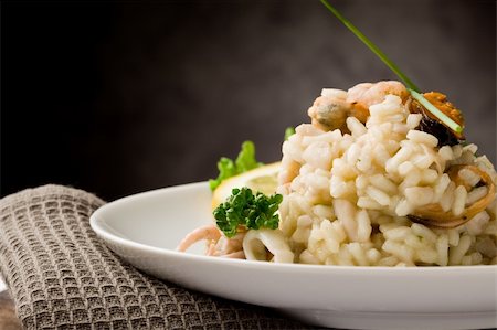 seafood risotto - photo of delicious risotto with seafood and parsley on it Stock Photo - Budget Royalty-Free & Subscription, Code: 400-04859382