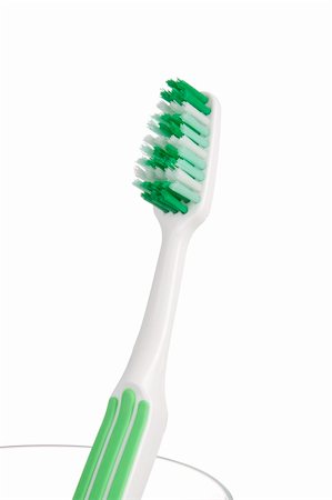Toothbrush in a glass Stock Photo - Budget Royalty-Free & Subscription, Code: 400-04859503