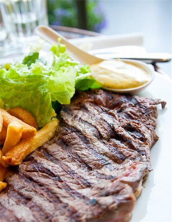 simsearch:400-05664697,k - juicy steak beef meat with salad and french fries Stock Photo - Budget Royalty-Free & Subscription, Code: 400-04850077