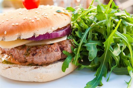 simsearch:400-05330097,k - Cheese burger - American cheese burger with fresh salad Stock Photo - Budget Royalty-Free & Subscription, Code: 400-04850073
