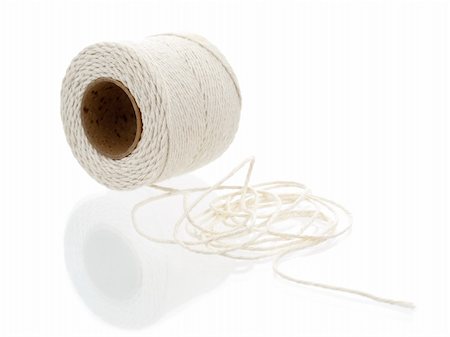 simsearch:400-08553199,k - Roll of hemp string isolated on white Fotografie stock - Microstock e Abbonamento, Codice: 400-04850432