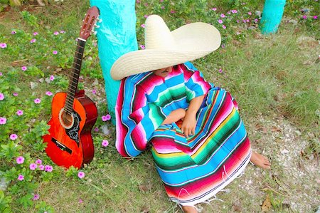 simsearch:400-04837520,k - Mexican lazy sombrero hat man poncho nap in garden typical topic Stock Photo - Budget Royalty-Free & Subscription, Code: 400-04850770
