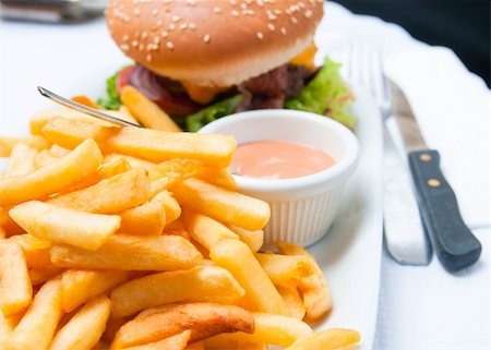 simsearch:400-05330097,k - Cheese burger - American cheese burger with fresh salad Stock Photo - Budget Royalty-Free & Subscription, Code: 400-04851284