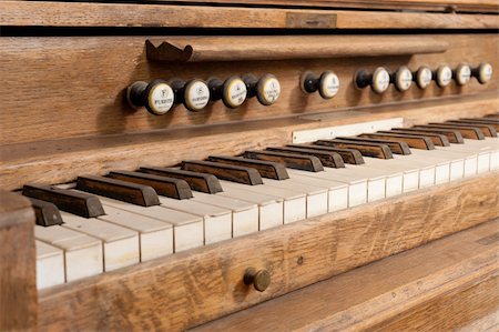 Vintage  wooden organ keyboard with its row of stops Stock Photo - Budget Royalty-Free & Subscription, Code: 400-04851392