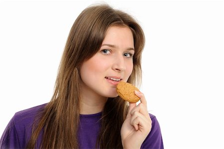 eat mouth closeup - girl with cookies, separately on a white background Stock Photo - Budget Royalty-Free & Subscription, Code: 400-04851430