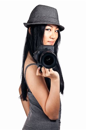 A young asian girl getting ready to take a photo with an SLR camera. Stock Photo - Budget Royalty-Free & Subscription, Code: 400-04851478