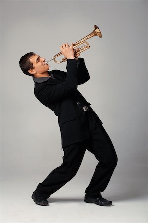 shyshka (artist) - Portrait of a young man playing his Trumpet Photographie de stock - Aubaine LD & Abonnement, Code: 400-04852552