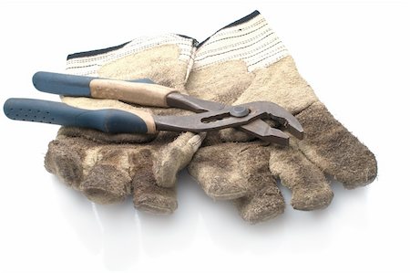 engrenagens - Dirty leather gloves and monkey wrench,isolated on white Foto de stock - Royalty-Free Super Valor e Assinatura, Número: 400-04852567
