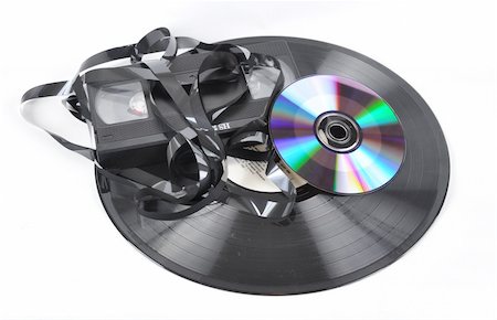 ruslan5838 (artist) - Picture of videokaseta of voice plate and compact disk disk on a white background Stockbilder - Microstock & Abonnement, Bildnummer: 400-04852734