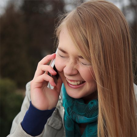 simsearch:400-04586228,k - Blond girl laughing and talking on cell phone Stock Photo - Budget Royalty-Free & Subscription, Code: 400-04852862