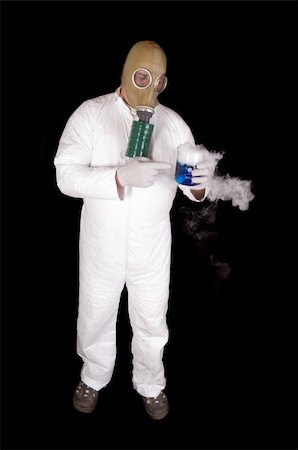 Man in Hazmat clothing in decontamination chamber wearing a gas mask and carrying toxic chemical that is exuding gaseous vapor Stock Photo - Budget Royalty-Free & Subscription, Code: 400-04853950