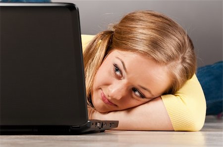 programmer (female) - woman is working on laptop lying on floor Stock Photo - Budget Royalty-Free & Subscription, Code: 400-04864756