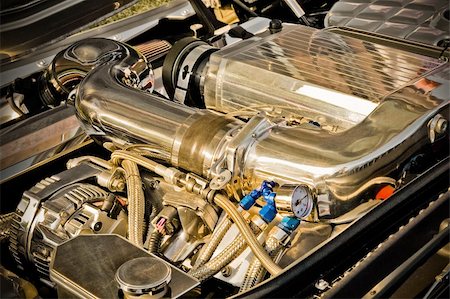 exhaust pipe - chromed vehicle engine bay with enhanced golden tones Photographie de stock - Aubaine LD & Abonnement, Code: 400-04865283